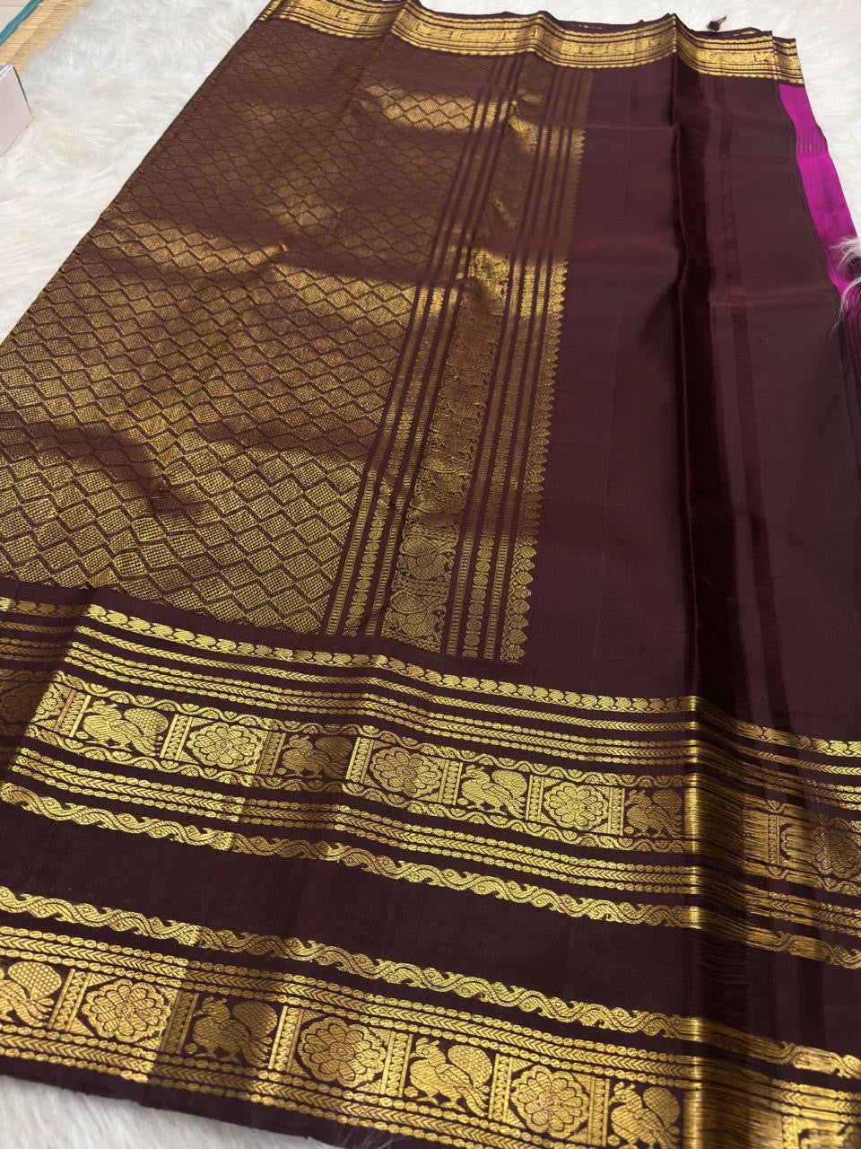 Vadamalli pink silk body with narrow oosivaanam gold lines and small spaced gold buttas
