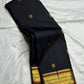 South Indian black silk saree with luminous traditional zari and heirloom-inspired detailing.