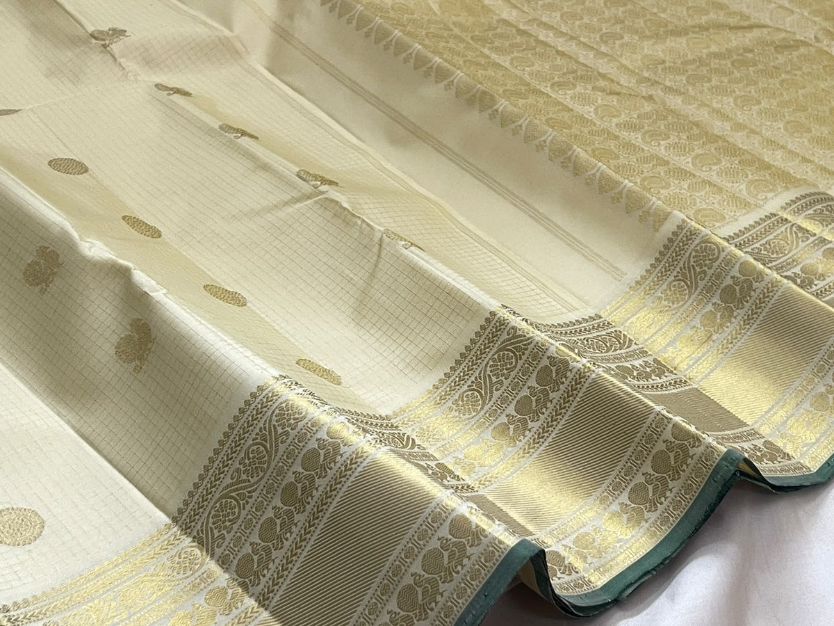 Warm ivory pure silk Kanchipuram saree with blouse piece, gold zari grid and Kili motifs — Idam Living