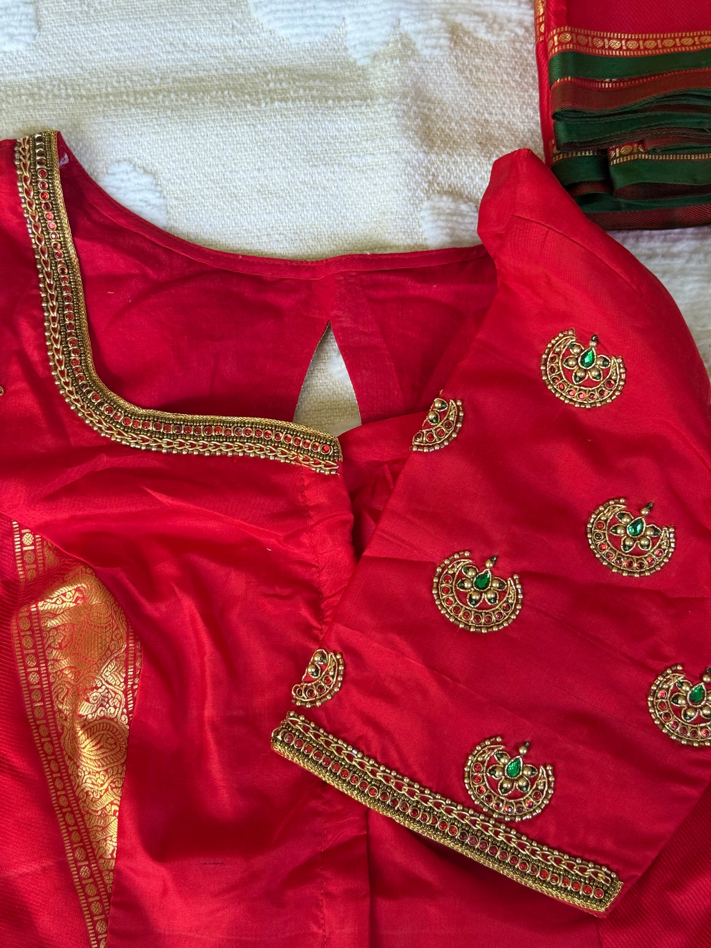 Custom handwoven silk blouse with traditional maggam embroidery and bridal kemp stone detailing