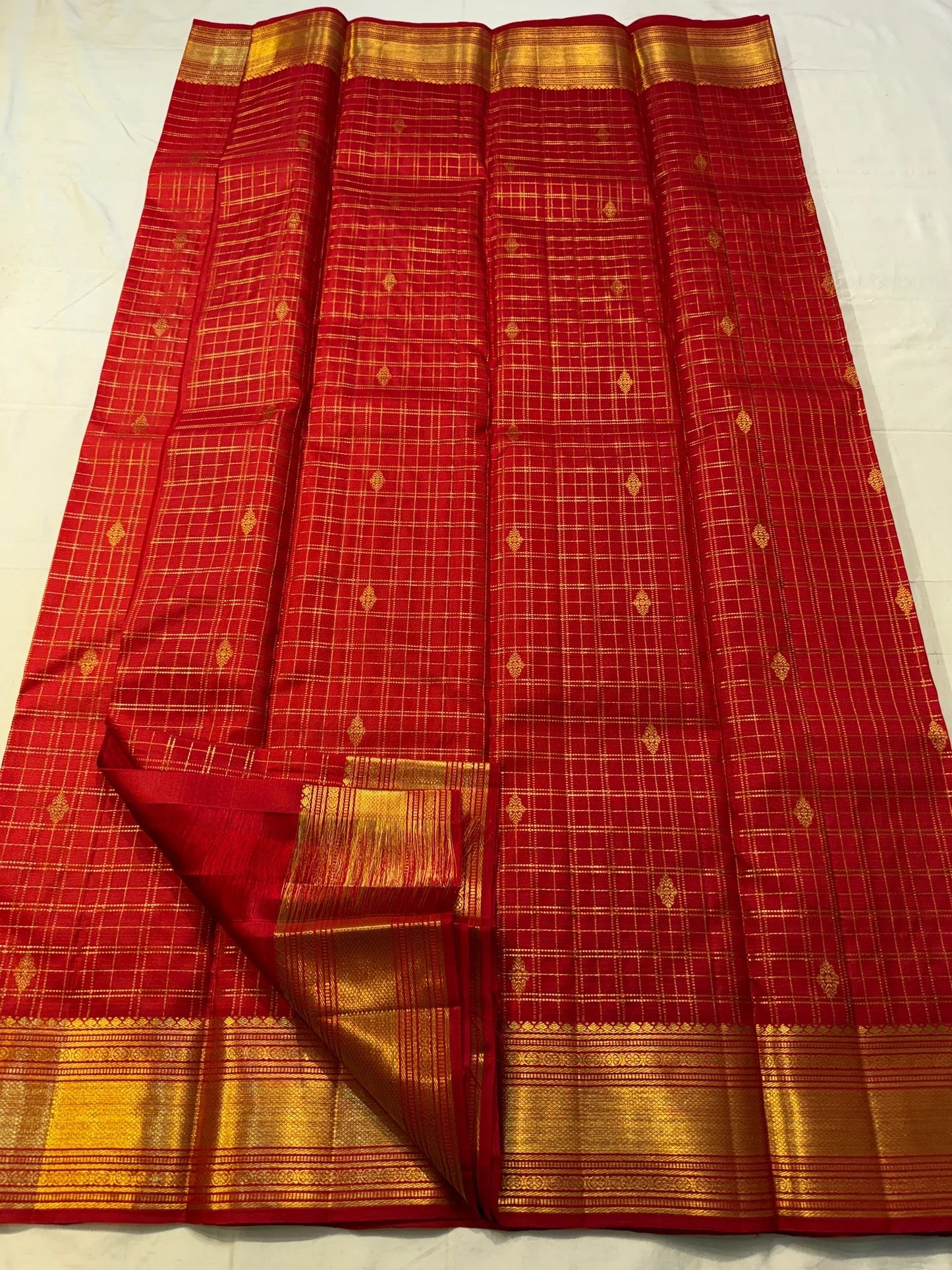 Royal maroon Kancheepuram silk saree with richly woven maanga seer pallu detail