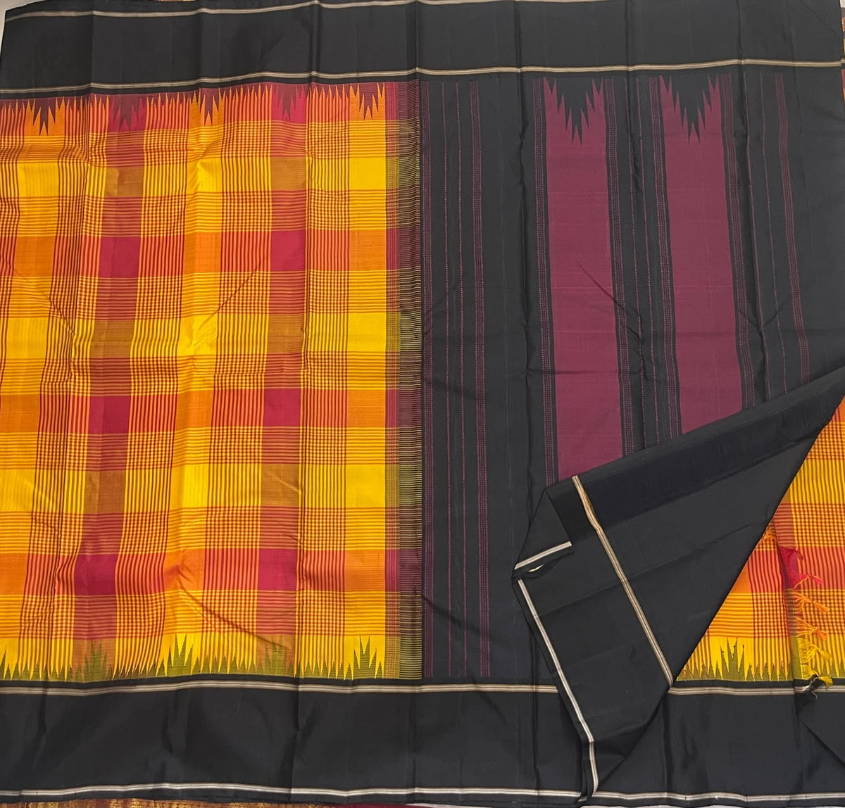Turmeric yellow Kanchipuram silk saree, temple reku border in yellow, orange and olive green with charcoal band