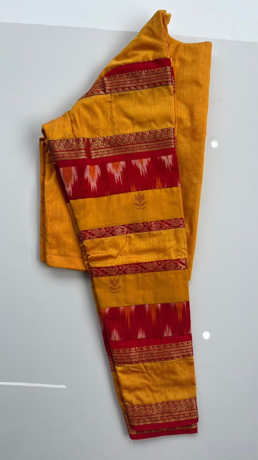 Traditional yellow Indian blouse with handwoven silk cotton and artisanal detailing