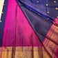 Full spread of navy Pure Kanchipuram silk saree with gold elephant buttas and wide magenta zari border, available in the USA.