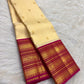 Warm ivory handwoven pure silk Kanjipuram Varisaipet saree with a magenta border