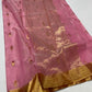 Close-up of magenta border with metallic pineapple and potted plant motifs on Chanderi silk