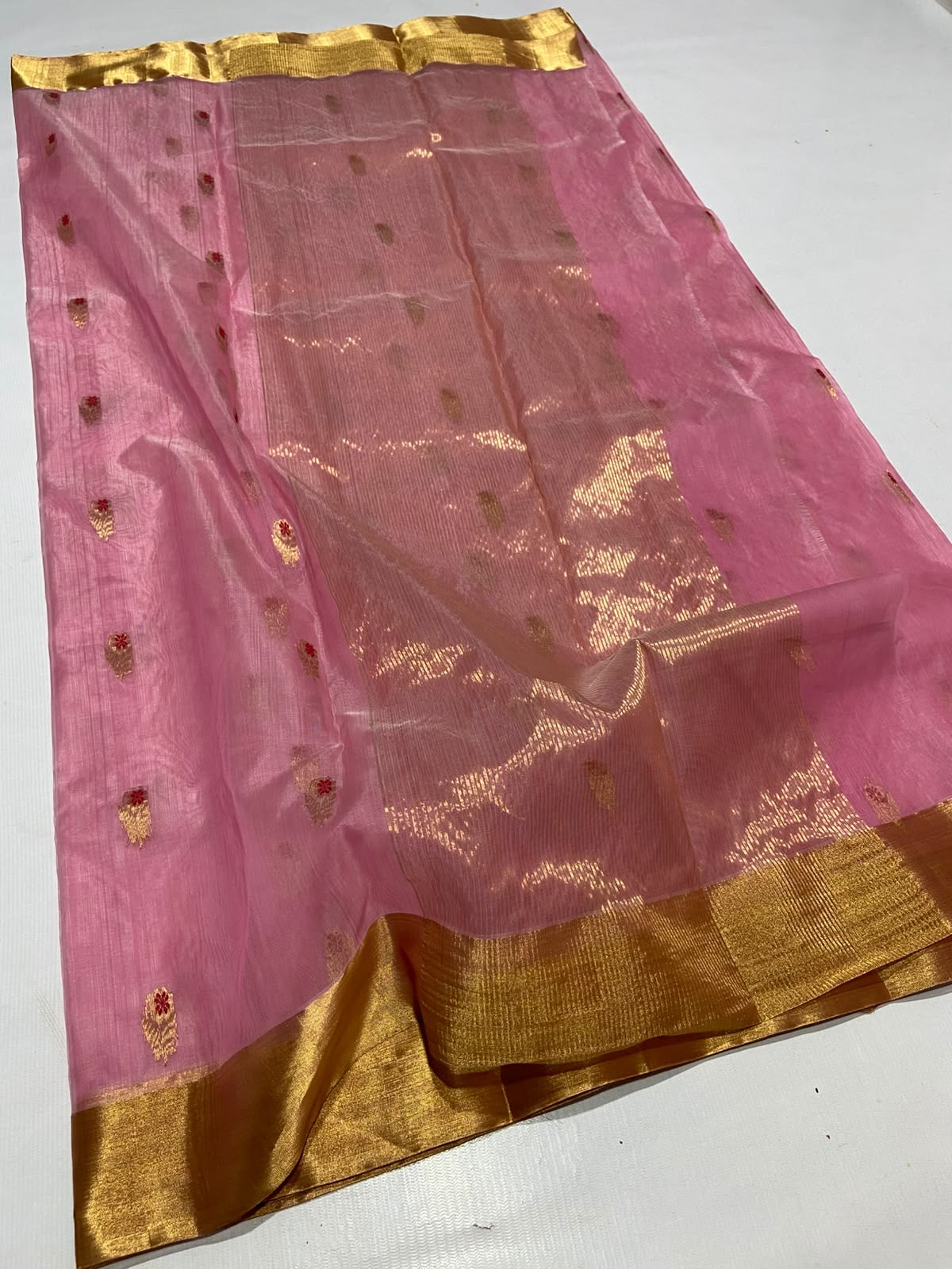 Close-up of magenta border with metallic pineapple and potted plant motifs on Chanderi silk
