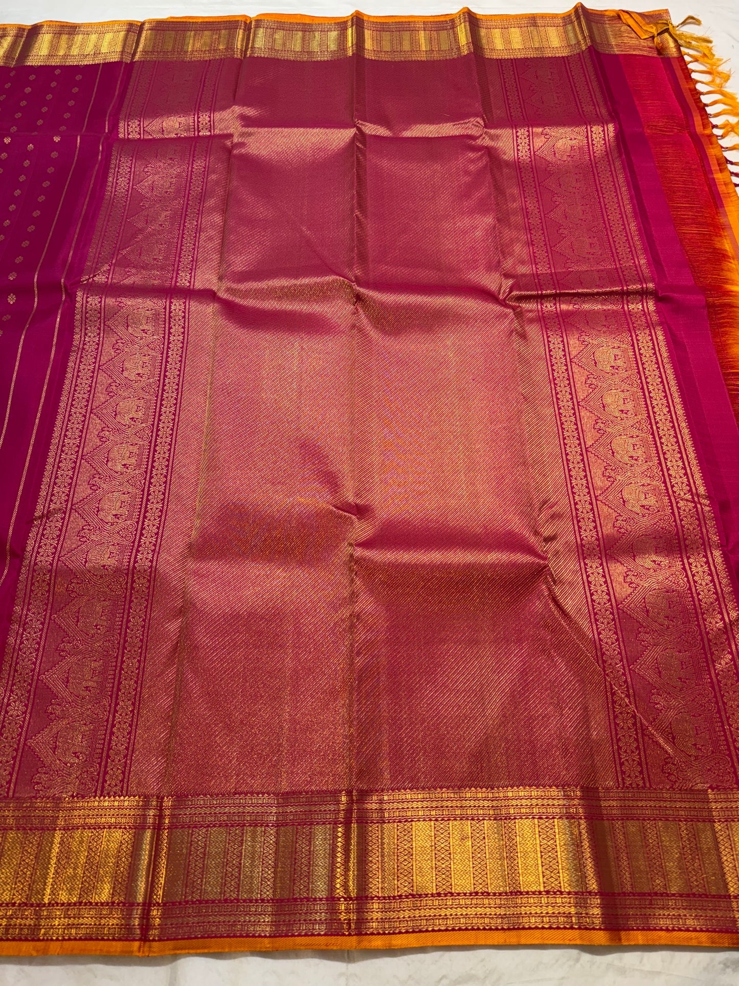 Full magenta Kanchi Pattu saree with kamalam butta, folded view