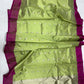 Rich magenta border framing the luminous lime green body of a Chanderi saree.