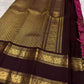 Handwoven magenta Zari Kattam saree with deep brown contrast border and traditional Mayil zari motifs.