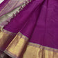 Heavy Getti gold-zari border on a magenta Kanchipuram saree.