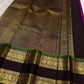 Border detail on the magenta rettapet saree with green highlight lines.