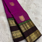 Handwoven pure silk Kanjivaram rettapet saree in magenta pink with larger gold buttas and a luminous tissue pallu.