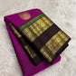 Displayed magenta pink handwoven Kanjivaram rettapet saree.