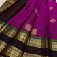 Rose-gold tissue pallu on the magenta pink Kanjivaram rettapet saree.
