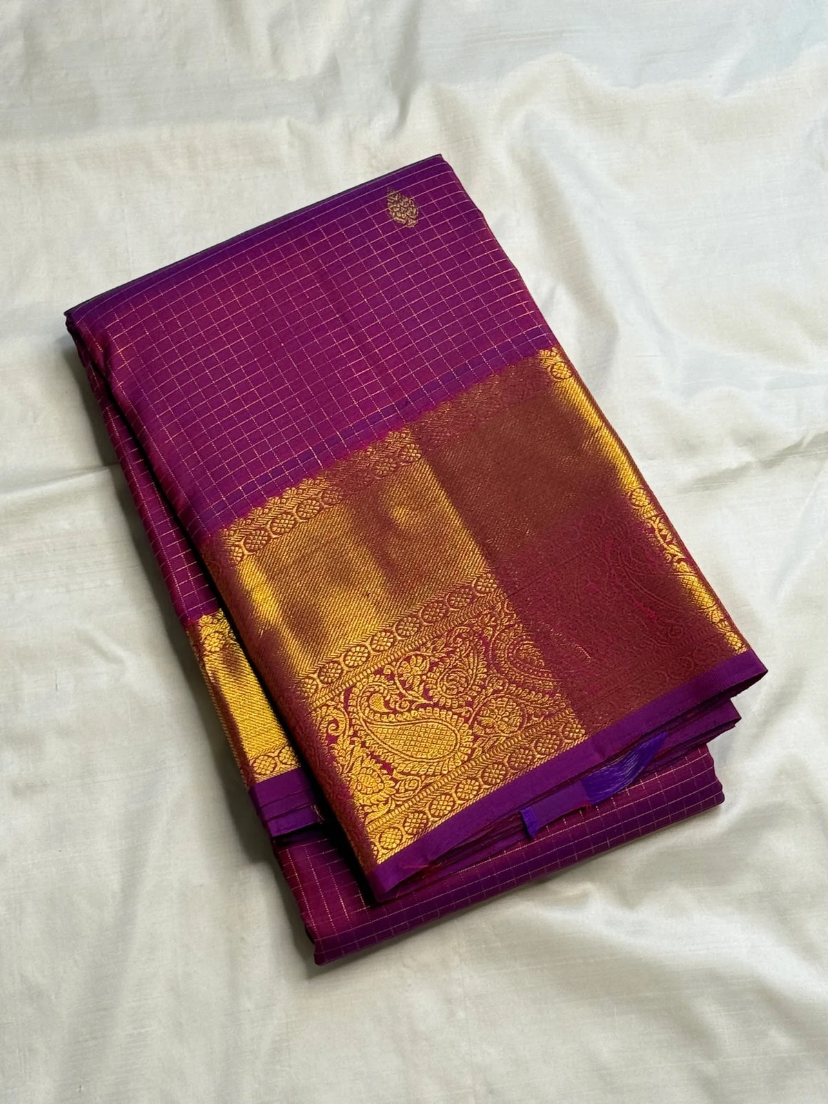 Close view of Zari Kattam grid and spaced zari buttas on purple silk
