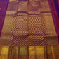 Broad paisley motif gold zari border on magenta Kanchipuram silk