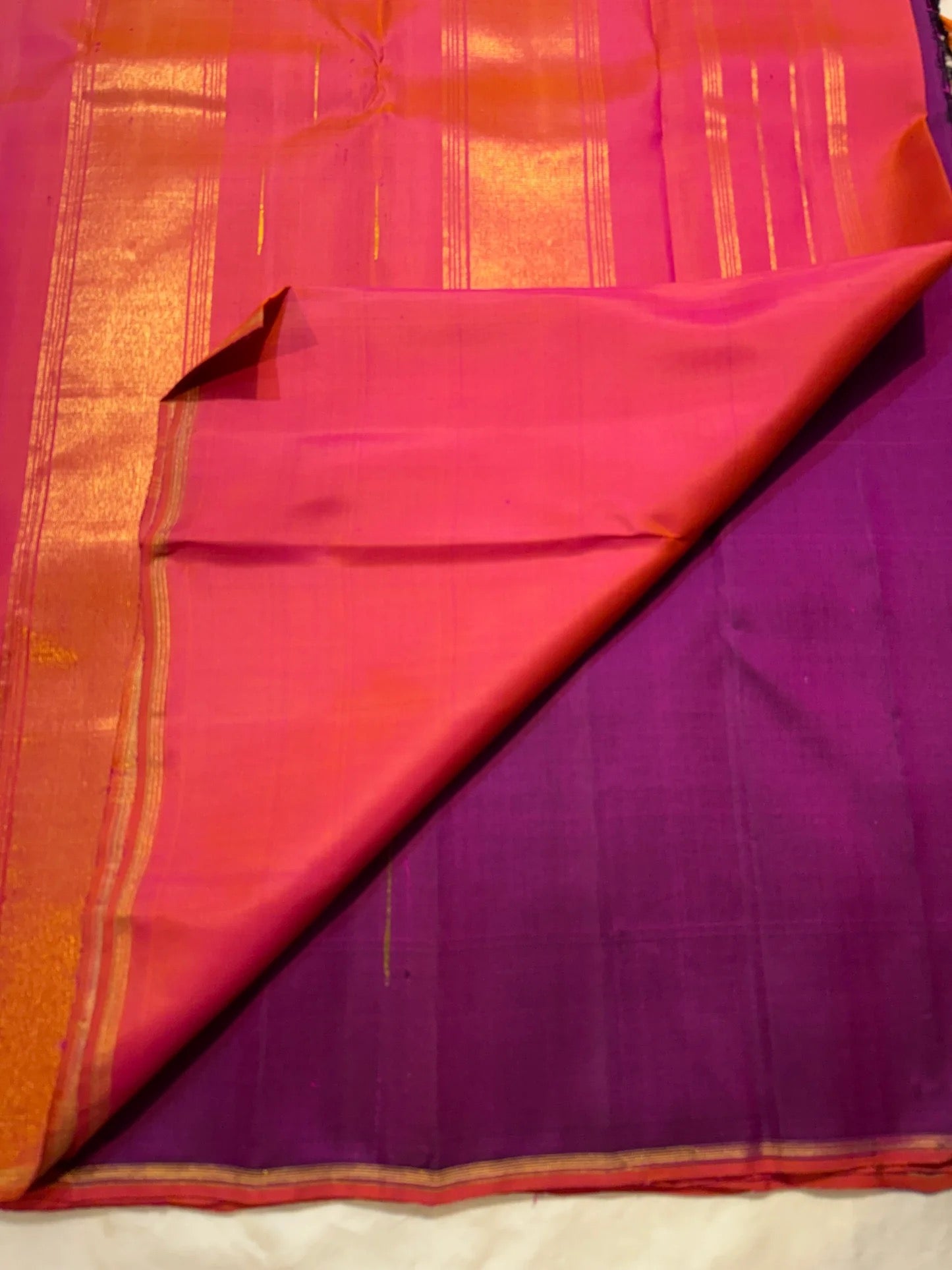 Magenta Violet Handwoven Pure Silk Kanjeevaram Saree with Malli Moggu Buttas and Coral Orange Pallu