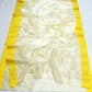 Moonlit ivory Chanderi Pattu Silk saree, alternate view with tiny rust-red florals and coordinating striped blouse fabric.