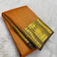 Manthulir-brown border detail on mango-yellow Kanjeevaram saree