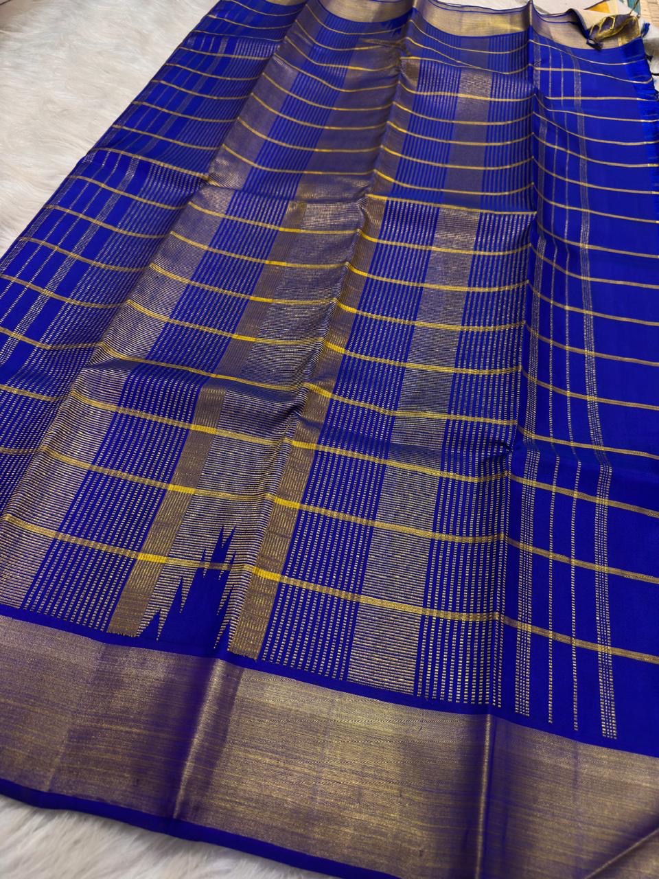 Mango Yellow and Royal Blue Lightweight Kanjivaram Kattam Saree with Seer Pallu showing blue seer pallu
