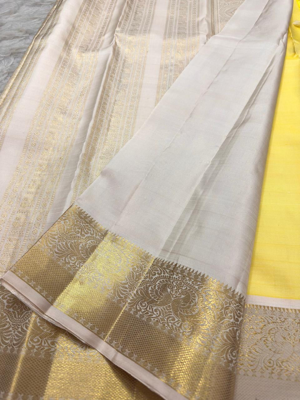 Soft yellow and warm ivory handwoven Kanchipuram silk saree
