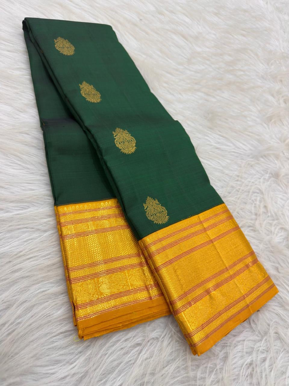 Peacock and Mayil Kann zari ornament set in a turmeric-yellow Varisaipet border