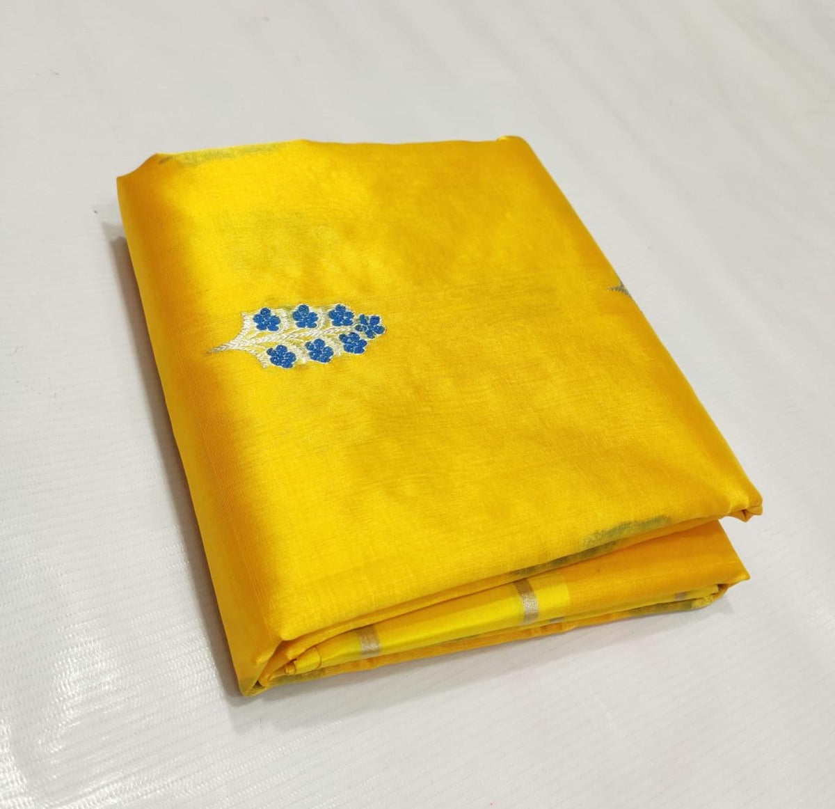Manjal yellow handwoven Pure Silk Chanderi saree with blue floral buttas