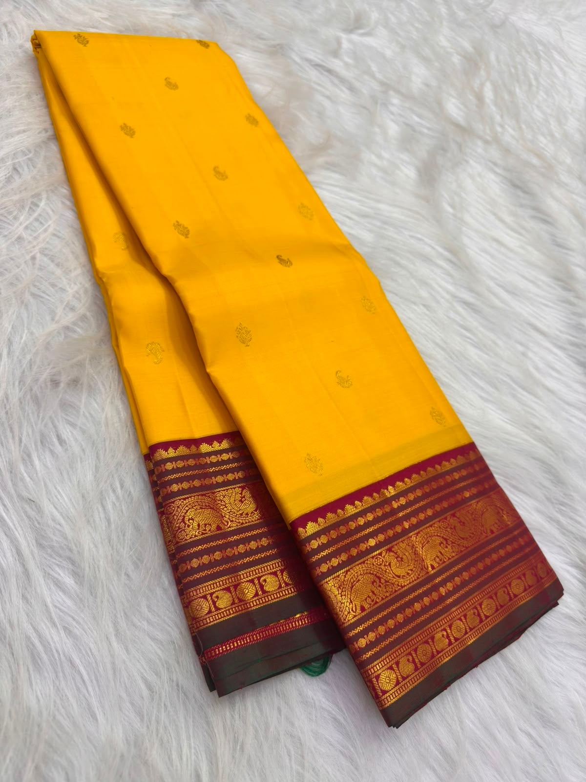 Manthulir green selvedge detail, Manjal yellow Kancheepuram Korvai saree