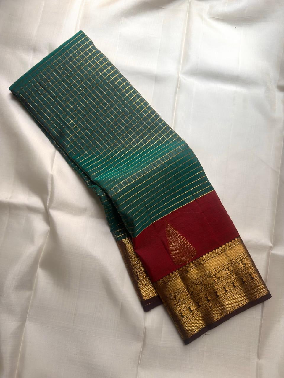 Maragatham Green Pure Silk Kanchipuram with fine classic-gold Zari Kattam.