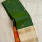 Double-shot leaf-to-emerald green with golden-mustard light pure silk Kanchipuram saree, maragatham green rettapet kanjivaram saree; traditional Rettapet weave.