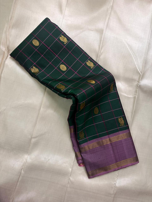 Maragatham-green Pure Silk Kanjipuram Rettapet saree with cool lavender-mauve border and gold zari.