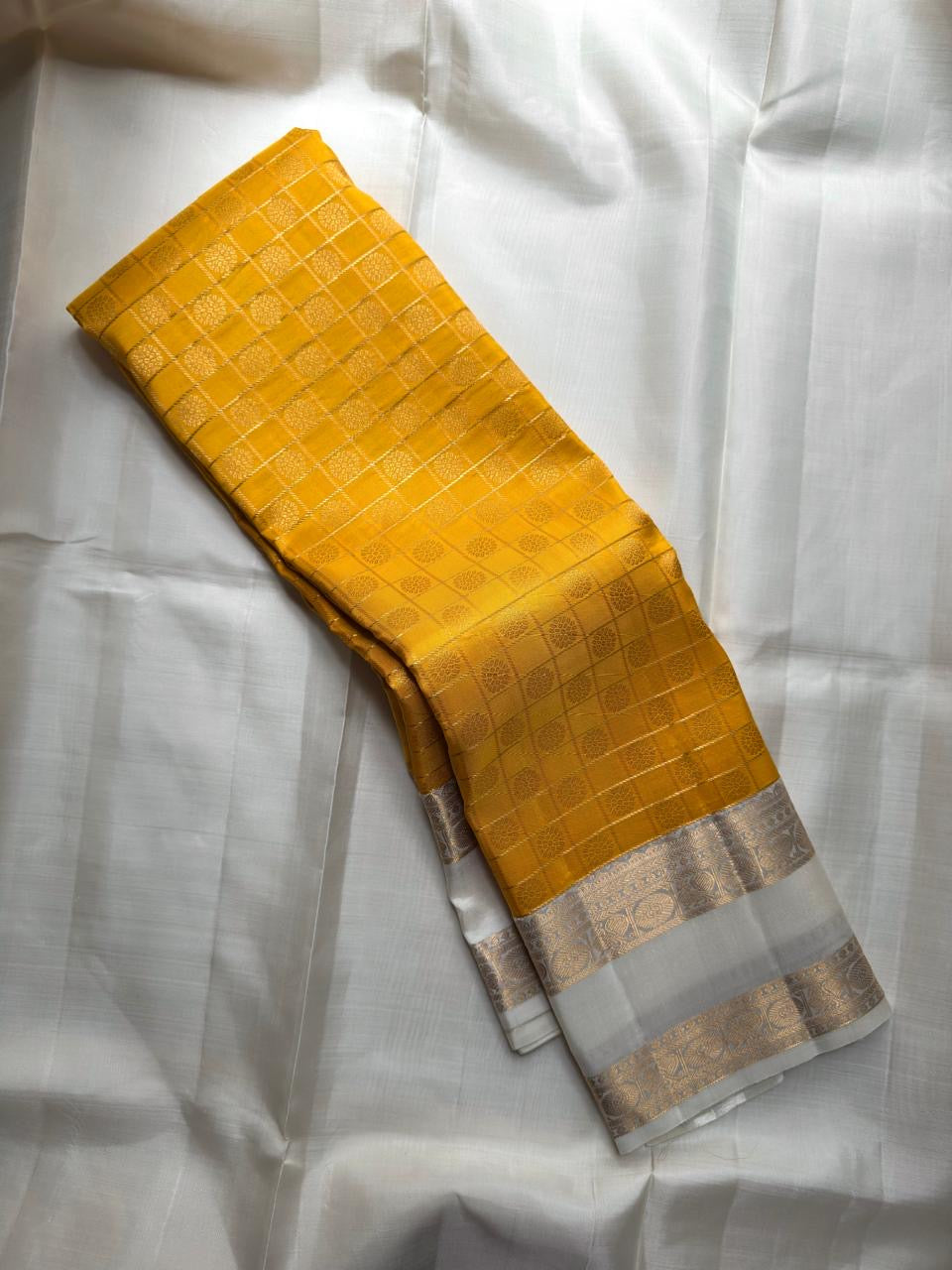 Ivory zari border detail, marigold pure silk Kanjivaram saree