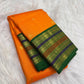 Marigold orange Kanjivaram silk saree with Maragatham green layered border.