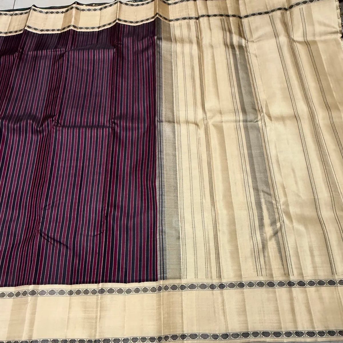 Traditional handwoven silk detail of the Maroon and Black Striped Premium Zariless Korvai Kanjivaram Saree with Off White Rettapet Rudraksham Borders.