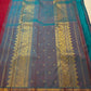Close-up of Kamalam Butta gold-zari motifs on maroon Kancheepuram silk body