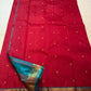 Teal petite border with gold elephant and chakra medallion band on maroon Kancheepuram saree