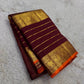 Handwoven Varisaipet saree with antique-gold peacock border and Burnt Orange selvedge.