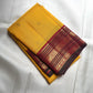 Deep Maroon Kanchipuram Korvai pallu showing dense gold zari geometry and richly woven ornamental side panels.