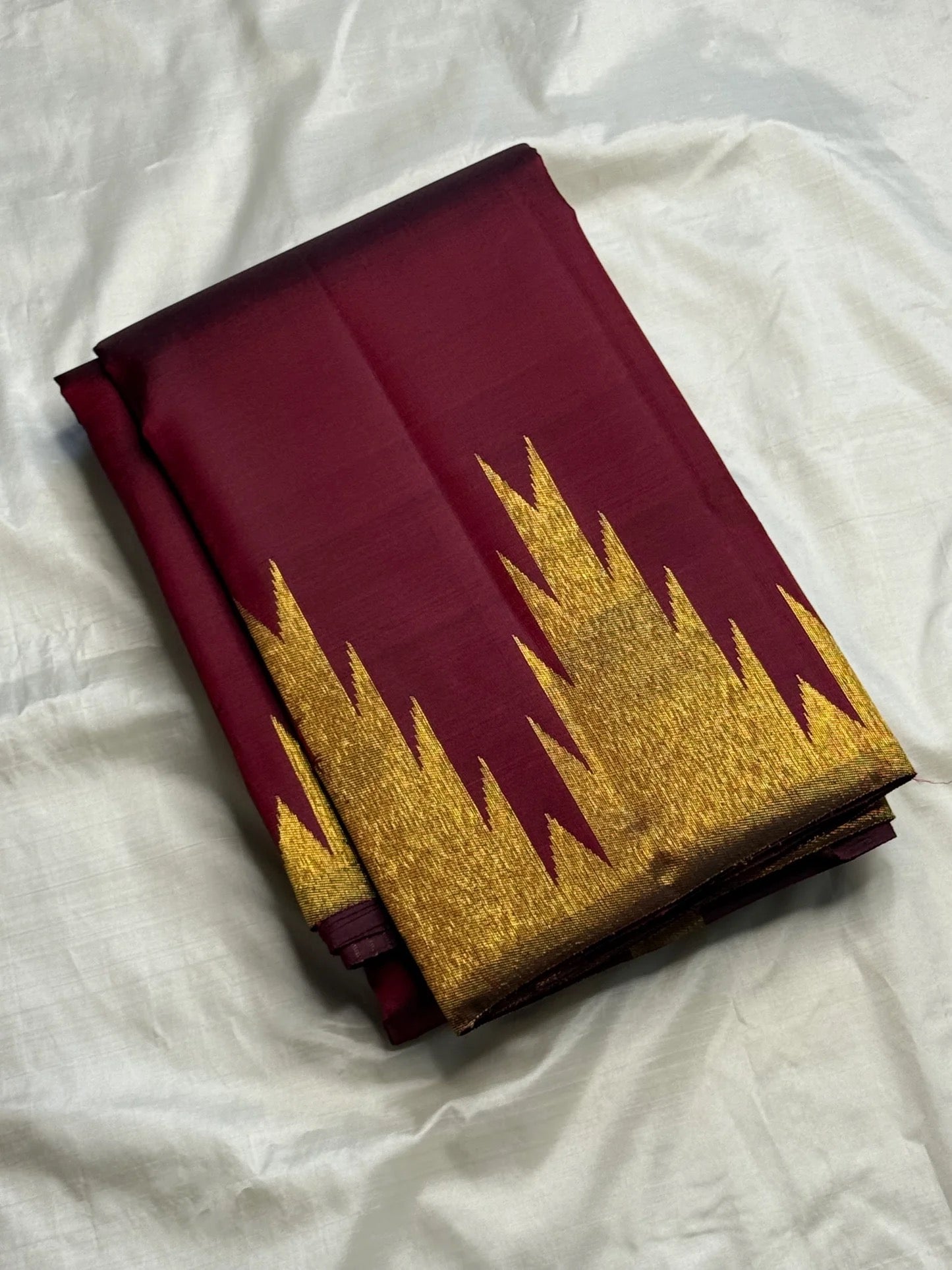 Deep maroon Ettukol Kancheepuram silk saree border, temple pattern