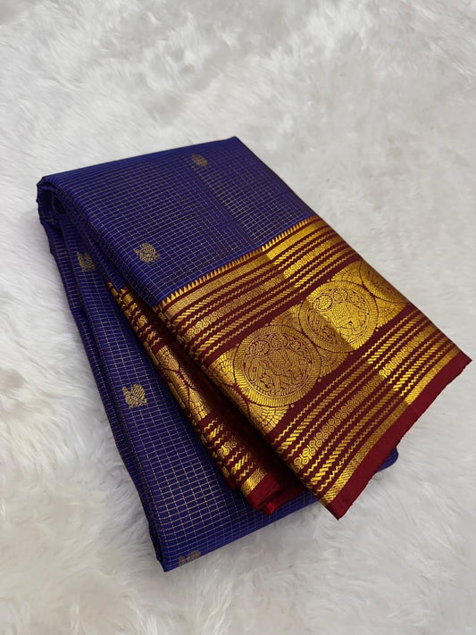 folded royal blue checked kanchipuram silk saree with maroon zari woven border