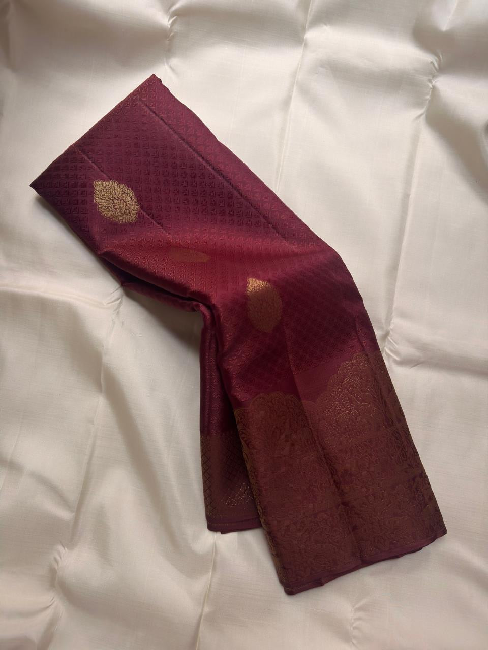 Maroon Kanchipuram silk saree showing traditional zari motifs, Idam Living