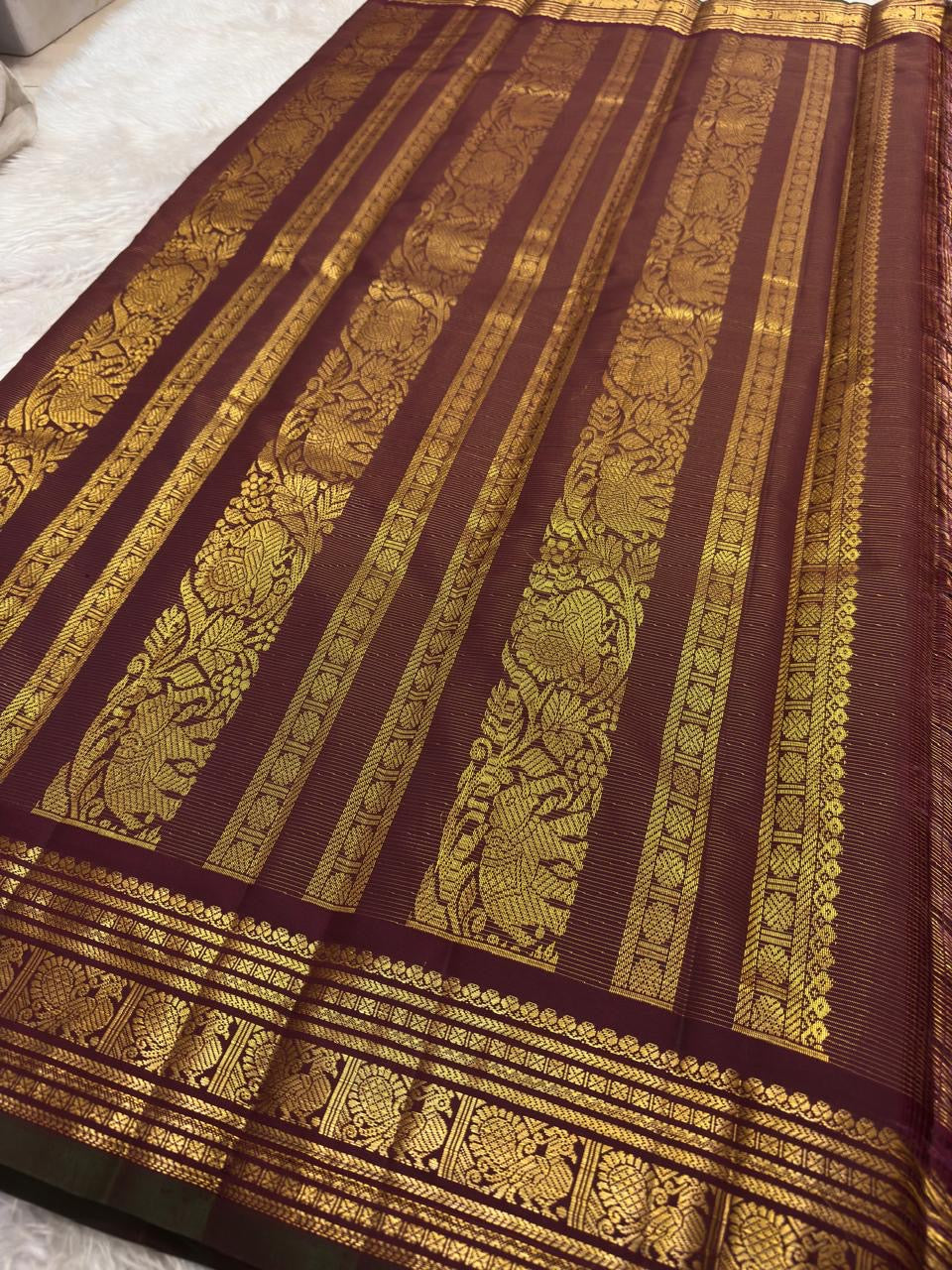 Rich dense gold zari pallu of handwoven maroon Kanjivaram lightweight silk saree — Idam Living