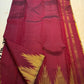 Deep maroon Kanjivaram silk saree with Ettukol temple border