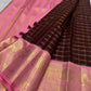 Deep maroon Kanjivaram Zari Kattam saree with a pink peacock zari border.