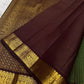 Close view of maroon pallu on a Pure Kanchipuram Silk Saree with fine zari lines and gold zari border featuring traditional motifs.