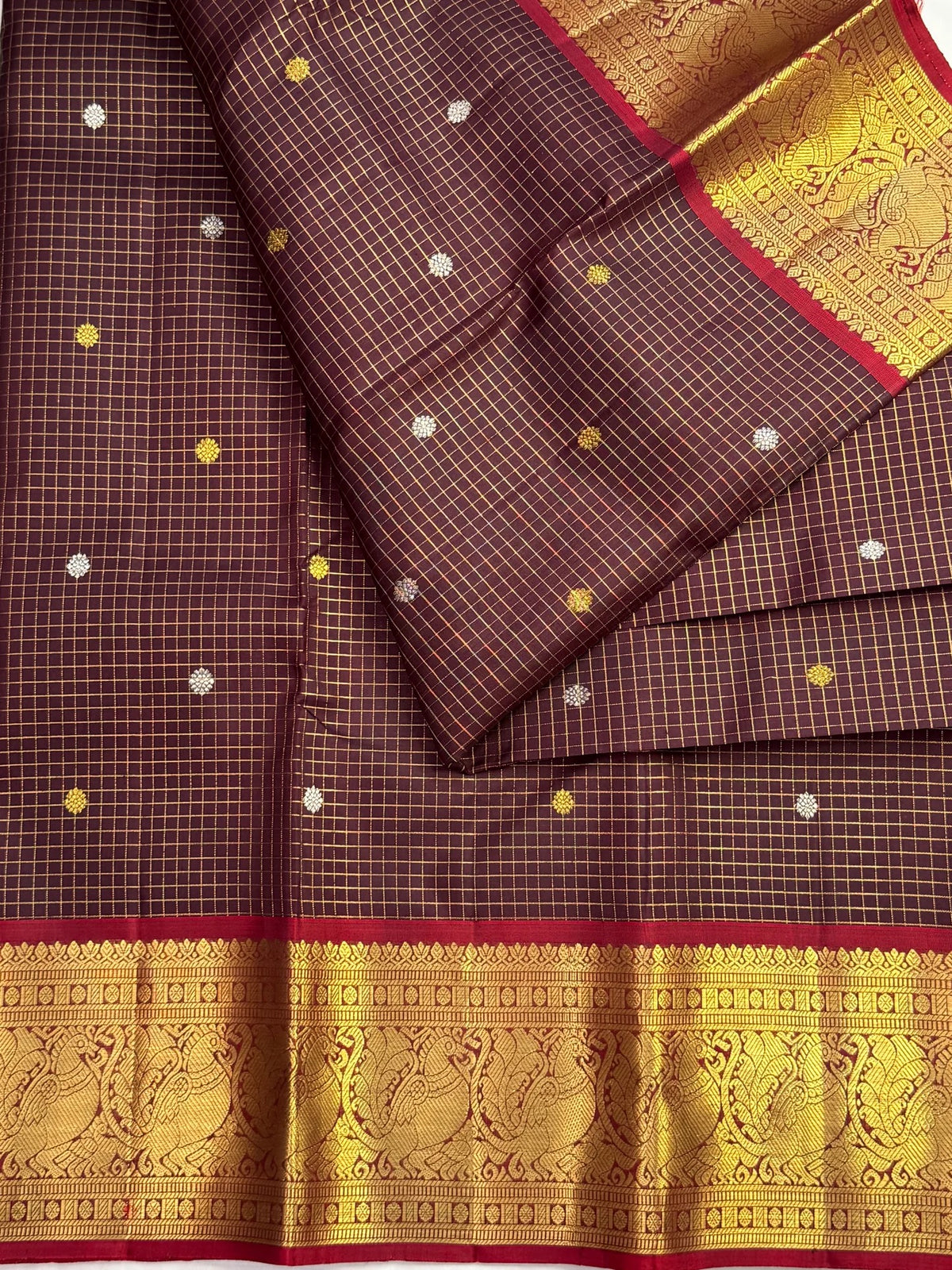 Maroon Kanchipuram border with ornate gold zari peacock motifs