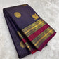 Folded deep plum purple Pure Kanchipuram silk saree with fine checked weave, gold zari woven motifs, and maroon zari woven border