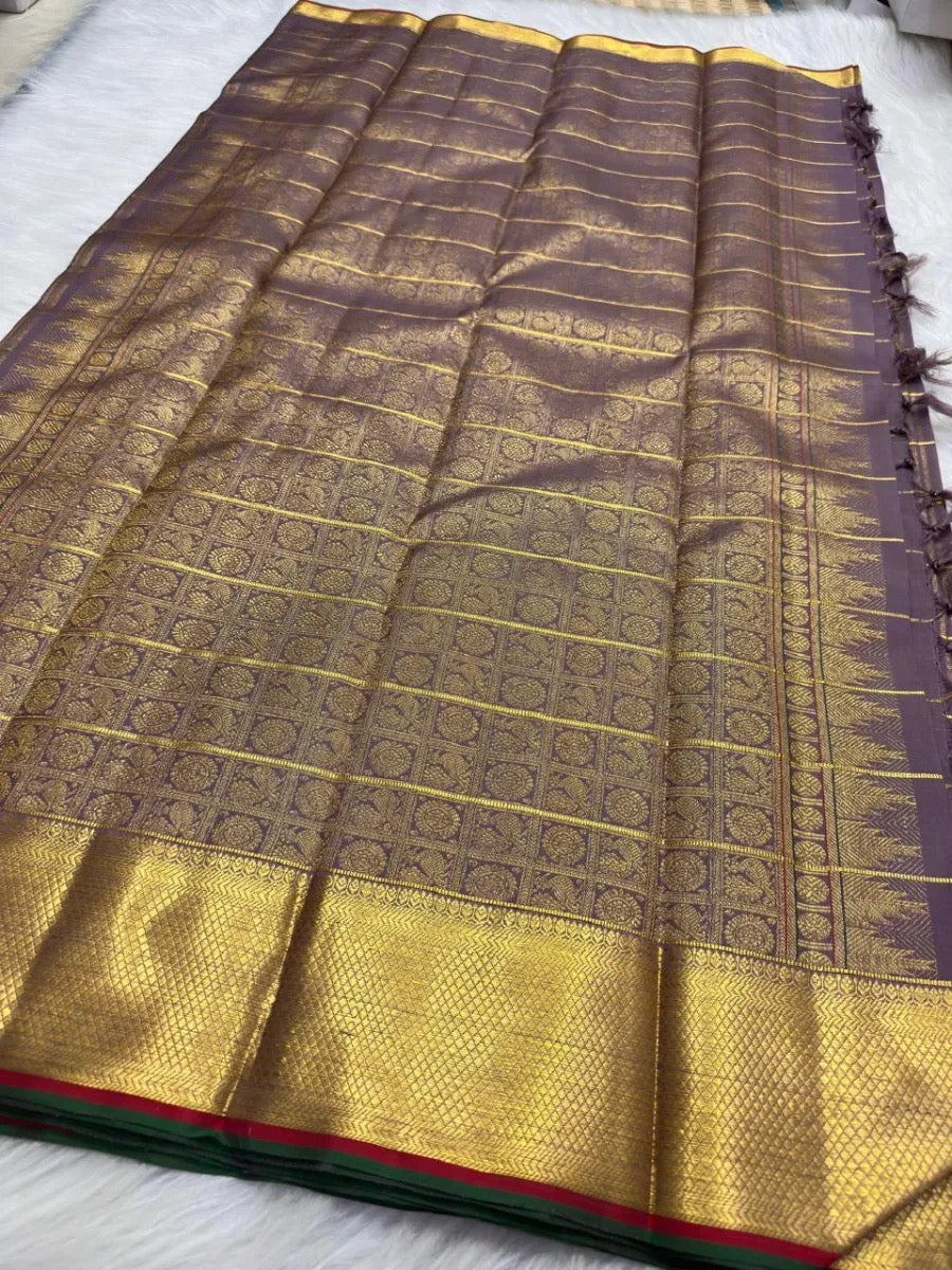 Close view of green silk-thread meenakari centre inside an antique-gold zari butta.