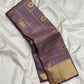 Mauve brown Kanchipuram silk saree with intersecting gold Zari Kattam lines and traditional buttas.